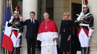Pope Leo with Emmanuel and Brigitte Macron at the Elysee Palace. Getty Images