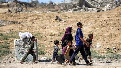 A family on the move to Gaza city. The enclave's civil defence agency said Israeli troops began withdrawing from parts of the territory, particularly in Gaza city and Khan Younis. AFP