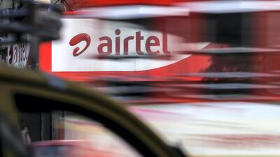 Motorist drive past a Bharti Airtel Ltd. store in Mumbai, India, on Saturday, April 21, 2018. Bharti Airtel are scheduled to release earnings on April 24. Photographer: Dhiraj Singh/Bloomberg