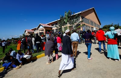 Parents and pupils gather at the Utumishi Girls' Academy Senior School after an overnight fire. Reuters