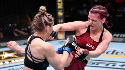 Gillian Robertson kicks Miranda Maverick in their lightweight fight. Jeff Bottari / USA TODAY Sports / Reuters