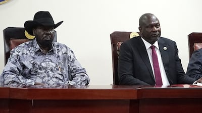 South Sudanese President Salva Kiir, left, and Vice President Riek Machar at the signing ceremony at Juba on April 3. AFP