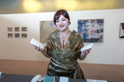 Sara Kamar explores how digital technology shapes memory and identity, questioning our growing reliance on devices to preserve personal experiences. Victor Besa / The National