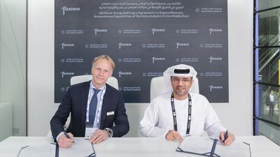Mohamed Al Shamisi, managing director and group chief executive of AD Ports Group, right, and Fugro chief executive Mark Heine at the signing ceremony in Abu Dhabi. Photo: AD Ports Group