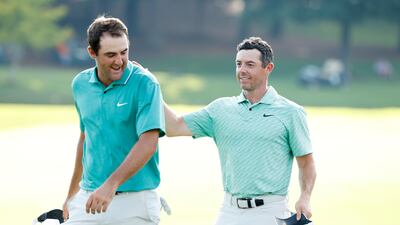 Scottie Scheffler congratulates Rory McIlroy on the 18th green after McIlroy won on Sunday. AFP