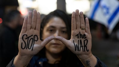 A protester attends a rally in Tel Aviv calling on Israeli Prime Minster Benjamin Netanyahu to end the war in Gaza and secure a hostage deal. Getty Images