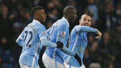 Manchester City's Kelechi Iheanacho and Yaya Toure celebrate after their winning goal on Saturday against Swansea City. Andrew Yates / Reuters / December 12, 2015