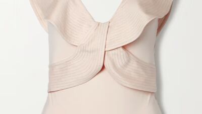 Ruffled swimsuits: from the luxe material and plunging neckline to the low-key ruffles and creamy ecru colour, this swimsuit by Johanna Ortiz will match with all beach accessories; Dh1,540.14, Johanna Ortiz at netaporter.com. Photo: Net-a-Porter