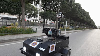 A Tunisian police robot patrols along Avenue Habib Bourguiba in the centre of the capital Tunis, as a means of enforcing a nationwide lockdown to combat the coronavirus pandemic. AFP