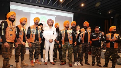 Member of the club with Virasat Sandhu, centre, a Punjabi singer and guest of honour at the event.