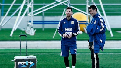 Lionel Messi takes a break during a training session. AFP
