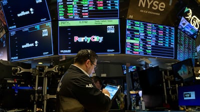 Traders work on the floor of the New York Stock Exchange during opening bell. AFP