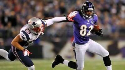 Torrey Smith, right, got help from his Baltimore Ravens family in pushing the heartache away, then went out and scored two touchdowns to help defeat the New England Patriots.
