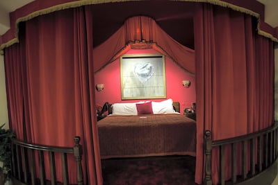 The presidential suite in Banksy's Walled Off Hotel has a home cinema and library. Heidi Levine for The National