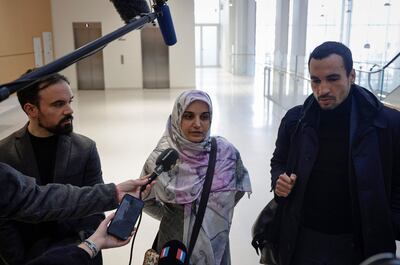 Iranian national Mahdieh Esfandiari with her lawyers Antoine Pastor, left, and Nabil Boudi. AFP