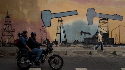Murals with designs alluding to oil companies outside one of the buildings of the state-owned company Petroleos de Venezuela in Caracas last week. EPA