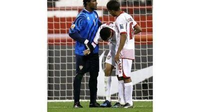 Walid Abbas, centre, scored an own goal to give Iraq victory.