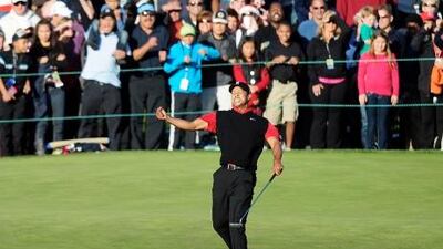 Tiger Woods celebrates victory at the 18th hole on the final day of the Chevron World Challenge at Sherwood Country Club in Thousand Oaks, California.