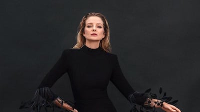 A black crepe column dress with feather detailing. Courtesy Jean-Louis Sabaji