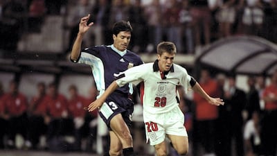 Michael Owen of England in action against Jose Chamet of Argentina during the 1998 World Cup match against Argentina played in St Etienne, France. Ross Kinnaird / Allsport