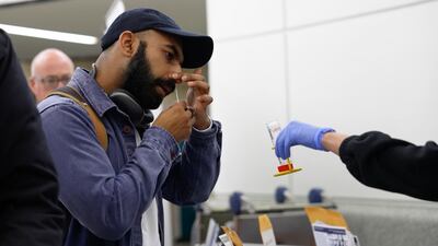 A person takes a Covid test at Newark Liberty International Airport in New Jersey. AP