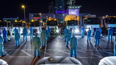 Tadweer workers get ready to disinfect the roads in Abu Dhabi. The nationwide sterilisation drive started on March 26. Victor Besa / The National