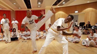 Members of Capoeira Abu Dhabi hold a batizado, a graduation ceremony, during May’s first biannual Capoiera Brazil festival at New York University in Abu Dhabi. Christopher Pike / The National