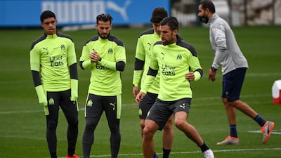 (fromL) Marseille's Brazilian forward Luis Henrique, Marseille's Argentine forward Dario Benedetto and Marseille's Dutch midfielder Kevin Strootman practice at the training camp of Marseille on October 26, 2020, on the eve of the Champions League football match against Manchester City. / AFP / Christophe SIMON