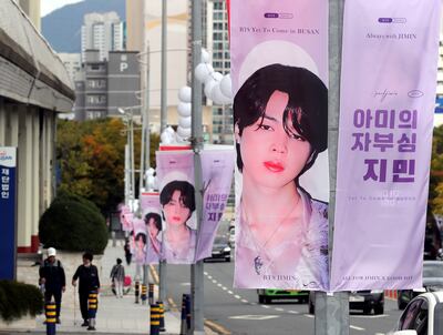 Banners featuring BTS member Jimin are displayed along a road near Busan Asiad Main Stadium in Busan, South Korea. AP