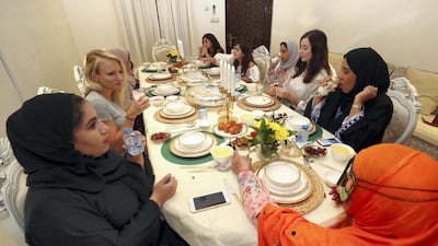 More than a dozen members of the Al Mansoori family - spanning three generations - embraced the Ramadan spirit by broadening their horizons and opening up their home to a pair of expatriate dinner guests.