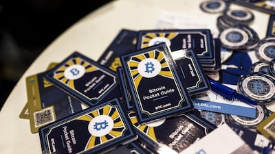 Bitcoin pocket information guides are distributed at the Lisbon Web Summit. Daniel Rodrigues / Bloomberg