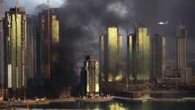 Smoke billows from a fire in a building under construction on Al Reem Island in the capital in October.