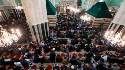 Palestinian Muslim worshippers gather for an early morning prayer at the Ibrahimi mosque, also known as the Tomb of the Patriarch -- a site holy to both Muslims and Jews where biblical patriarch Abraham is believed to have been buried, in the flashpoint city of Hebron in the occupied West Bank. AFP
