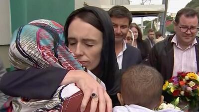 New Zealand Prime Minister Jacinda Ardern hugs a woman as she visited a tribute to Christchurch attack victims, in Wellington, March 17, 2019. AP