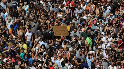 People march down Las Ramblas the day after a van crashed into pedestrians in Barcelona, Spain. Sergio Perez / Reuters.