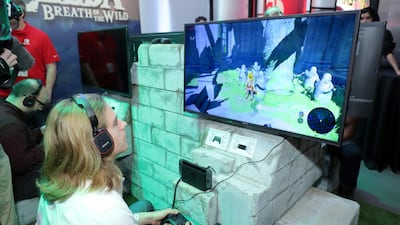 A guest enjoys playing The Legend of Zelda: Breath of the Wild on the groundbreaking new Nintendo Switch at a special preview event in New York. Getty Images/AFP