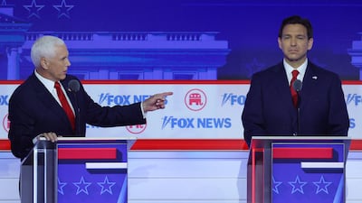 From left, Mike Pence and Ron DeSantis at the first Republican presidential debate in Milwaukee. Reuters