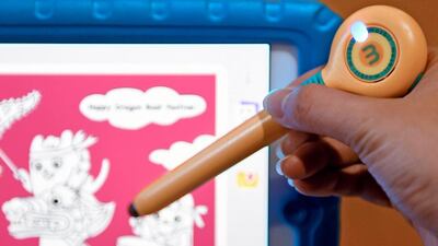 A man tests Mozbii's direct color capture stylus. The Taiwanese startup last year raised $45,000 through crowdfunding site Kickstarter for what it bills as the 'world’s first colour picking stylus'. Sam Yeh / AFP