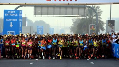 Runners cross the start line of the Standard Chartered Dubai Marathon in Dubai, United Arab Emirates, Friday Jan. 24, 2014. (STR)
