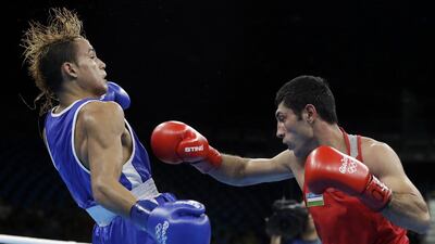 Uzbekistan’s Shakhobidin Zoirov, right, fights Venezuela’s Yoel Segundo Finol during a men’s flyweight 52kg semi-final boxing match at the 2016 Rio Olympics in Rio de Janeiro, Brazil, Friday, August 19, 2016. Frank Franklin II / AP Photo