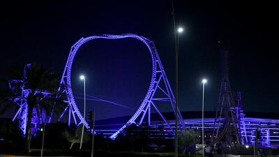 Ferrari World theme park lights up in blue to mark International Angelman Day at Yas Island. Khushnum Bhandari / The National