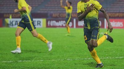 Issah Yakubu (R) of Al Ahed Football Club of Lebanon celebrates after scoring the winning goal during the AFC Cup Final in Kuala Lumpur. EPA