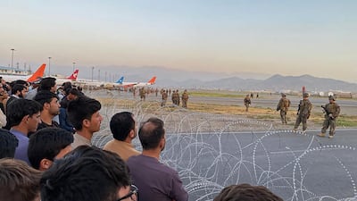 Afghans crowd Kabul Airport during the evacuation following the Taliban takeover in 2021. AFP