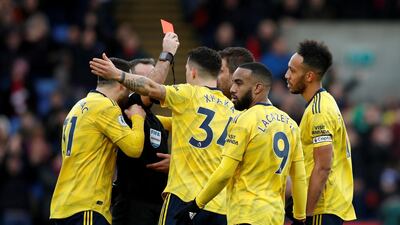 Pierre-Emerick Aubameyang, right, is shown a red card by referee Paul Tierney during Arsenal's Premier League match against Crystal Palace. Reuters
