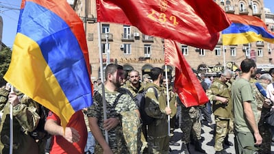 People attend a meeting to recruit military volunteers after Armenian authorities declared martial law and mobilised its male population following clashes with Azerbaijan over the breakaway Nagorno-Karabakh region in Yerevan, Armenia. Reuters