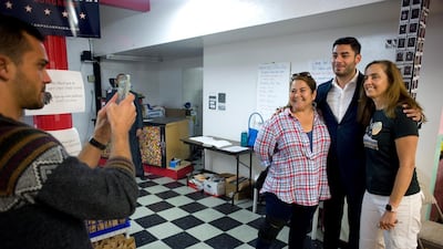 Ammar Campa-Najjar, candidate for US Congress, CA 50th District, poses for photographs with supporters before they begin to canvass houses at campaign headquarters in Escondido, California. EPA