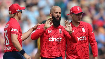 England's Moeen Ali celebrates with teammates Sam Curran, left, and Jason Roy after his dismissal of South Africa's Rilee Rossouw. AFP