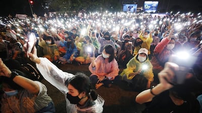 Pro-democracy protesters hold up lights from their mobile phones during an anti-government protest in Bangkok, Thailand. EPA