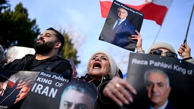 People in Frankfurt, Germany, carry portraits of Reza Pahlavi, the exiled son of the last shah of Iran, during protest in front of the US consulate general. AFP
