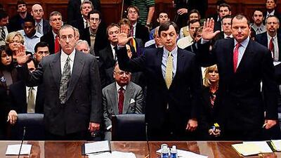 Roger Clemens, right, was indicted for allegedly making false statements to Congress.